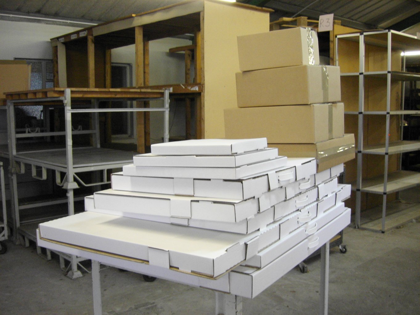 20 pallets of boxes white and brown.jpg.jpg
